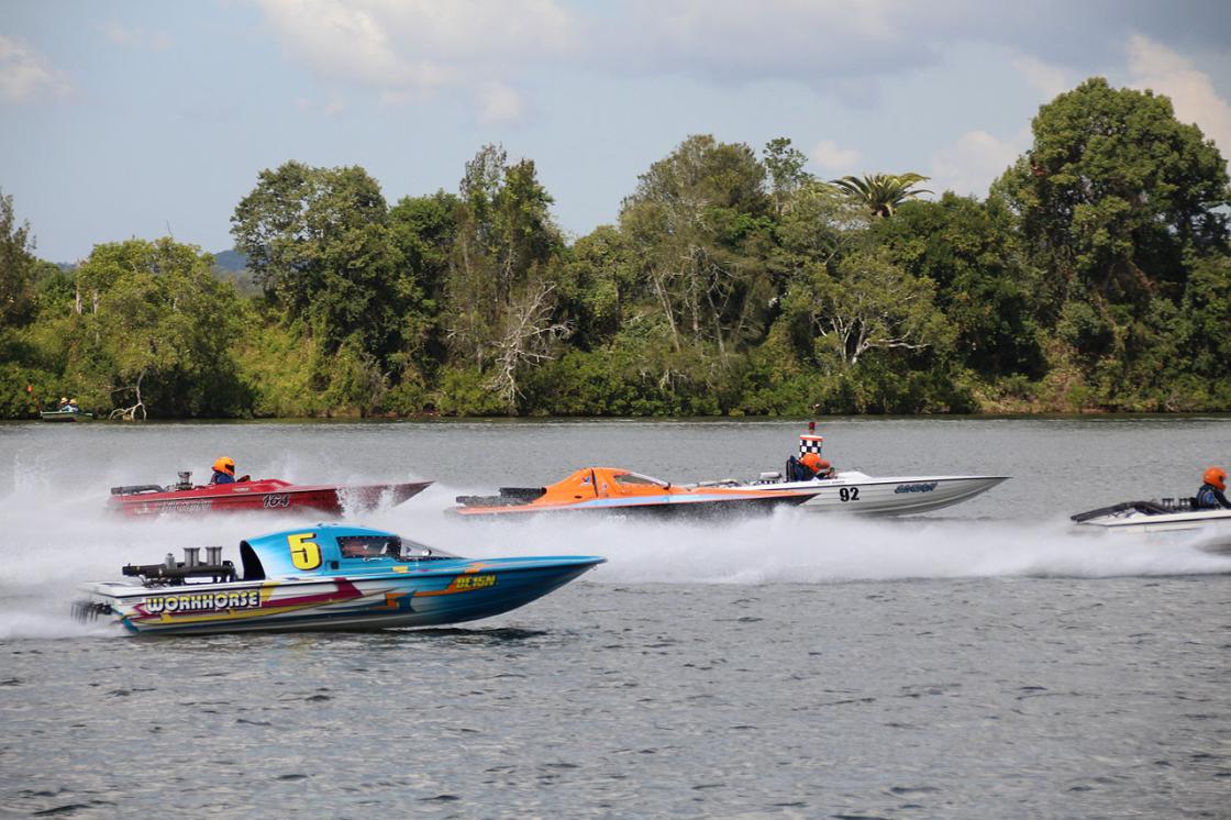 Powerboats race at high speed during the Easter Powerboat Classic on the Manning River, a highlight among adrenaline-filled events NSW hosts in April.